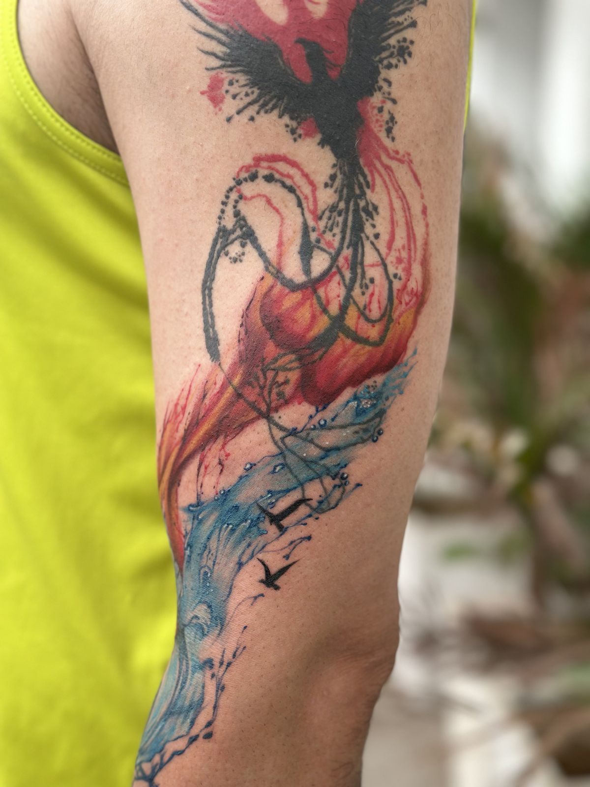 Phoenix tattoo on an arm by Tattoo Ink Master