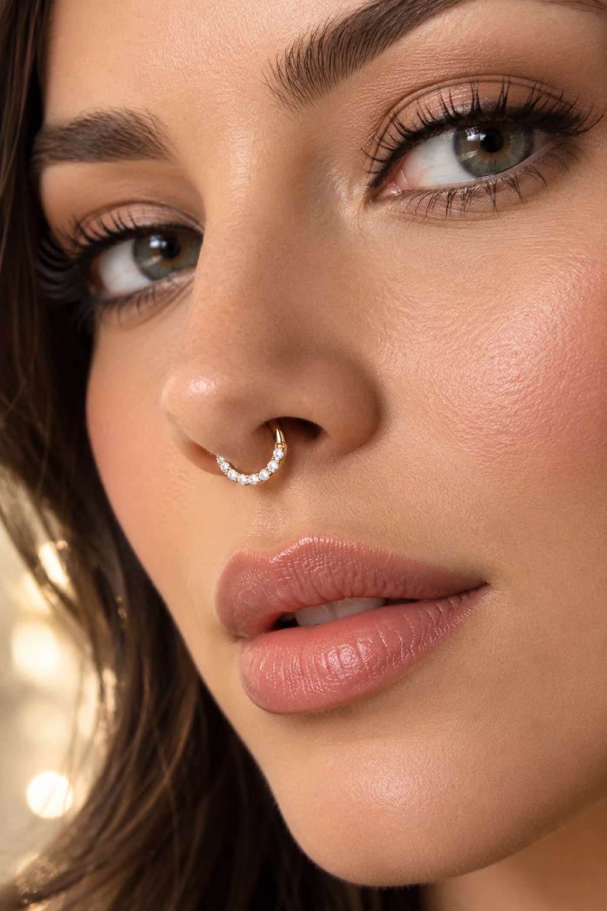 Close-up of a septum hoop piercing