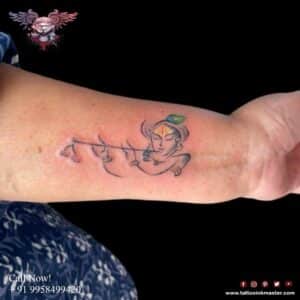 Read more about the article Soulful Krishna Tattoo Face with Flute