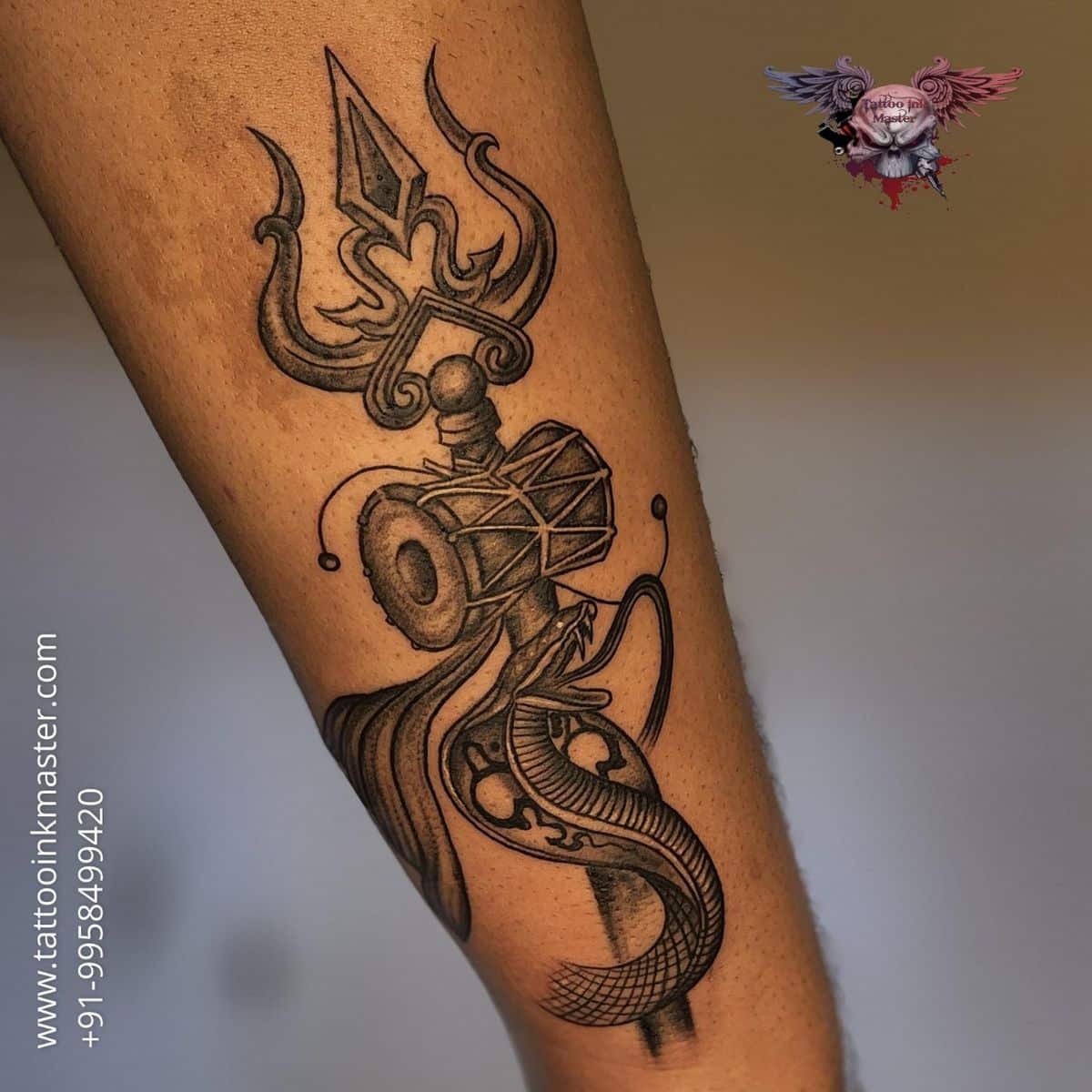 This Trishul tattoo is a mesmerizing fusion of divine elements, each detail  meticulously etched with reverence. Adorning it, Shiva's thir... | Instagram